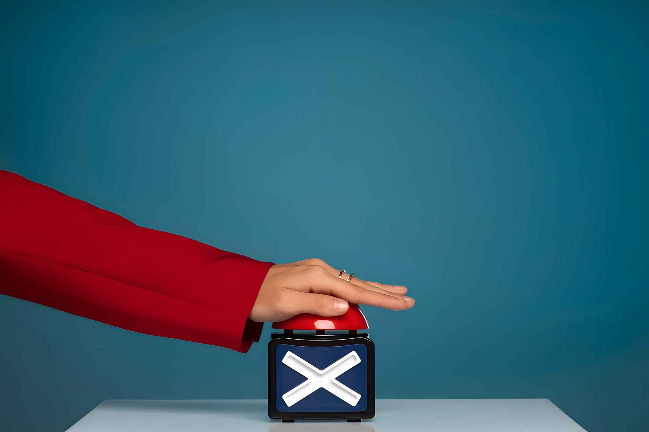 Side view of a hand pressing a button
