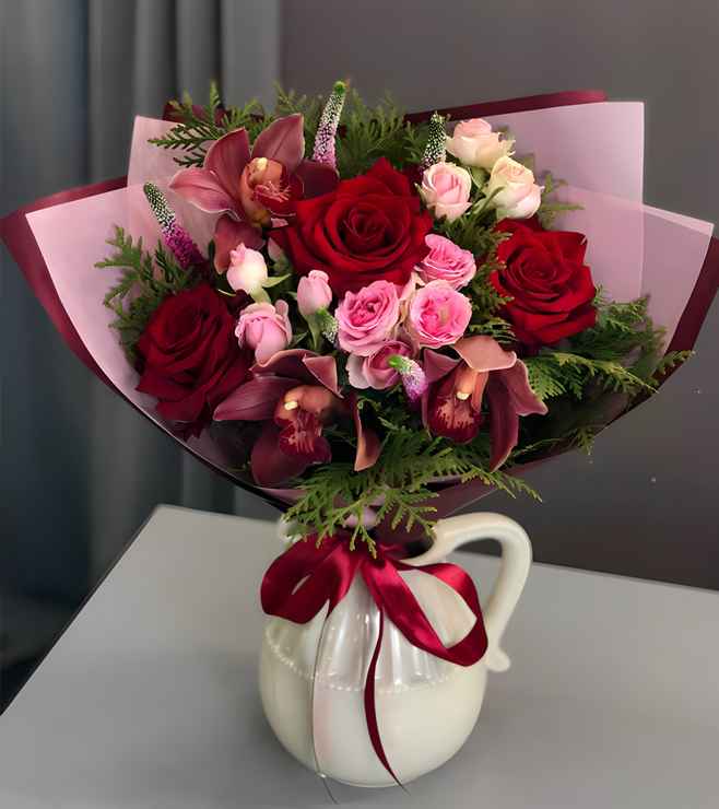 Festive floral arrangement with a mix of red and white flowers