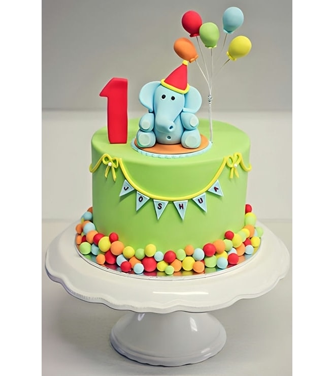 كعكة على شكل فيل صغير وبالونات