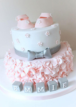 Two Tiered Baby Shoes & Flower Petals Cake